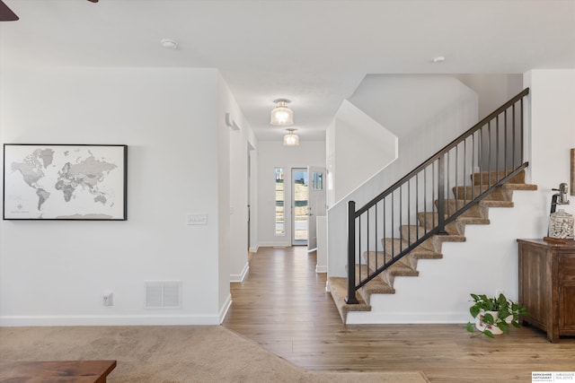 foyer with wood-type flooring