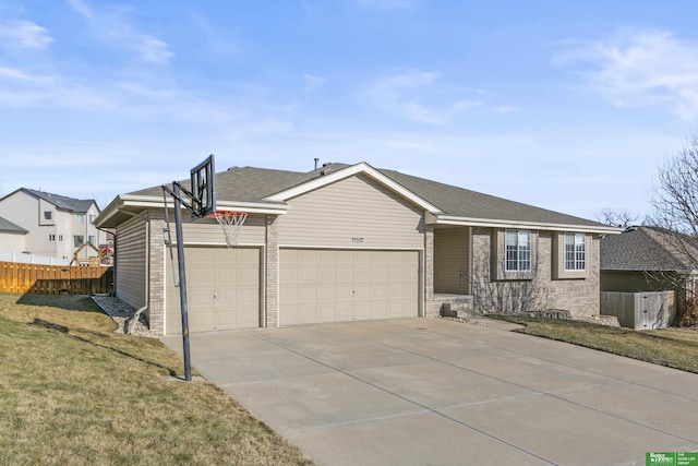 ranch-style house with a front yard and a garage