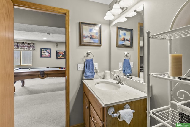 bathroom featuring billiards and vanity