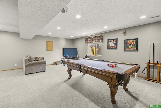 rec room with pool table, carpet flooring, and a textured ceiling