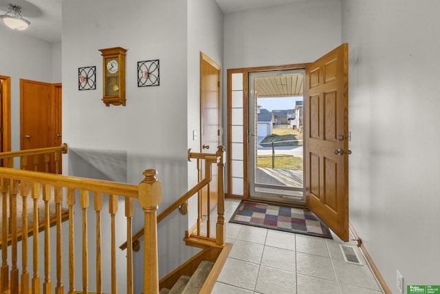 entryway featuring light tile patterned floors