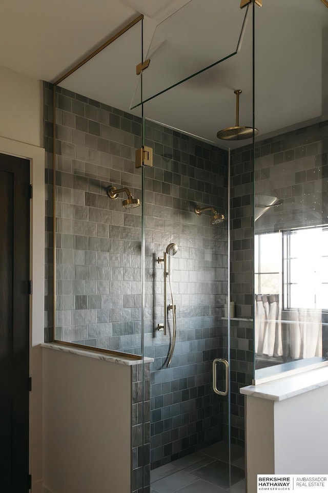 bathroom featuring an enclosed shower