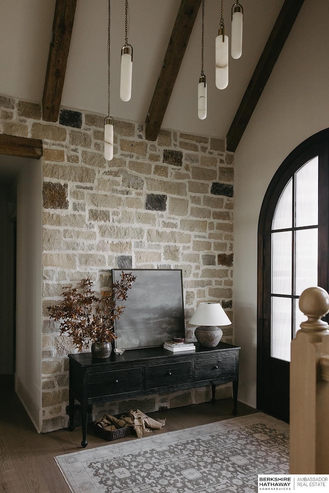 interior space with hardwood / wood-style flooring and beam ceiling