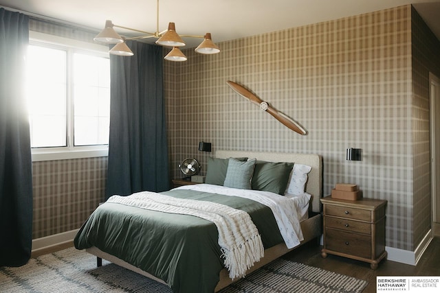 bedroom featuring ceiling fan and dark hardwood / wood-style flooring