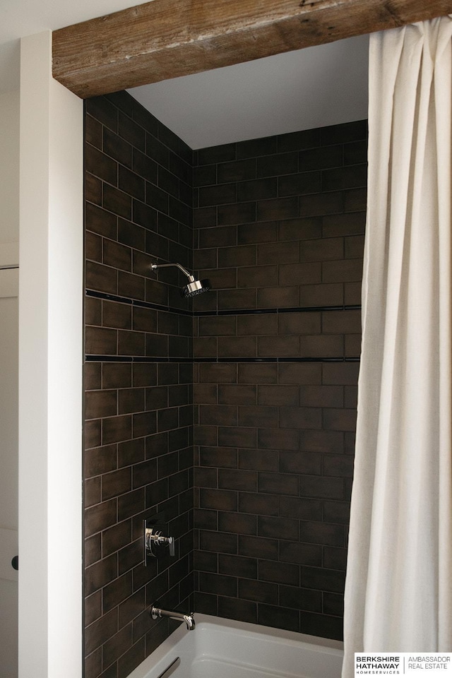 bathroom with shower / bath combo with shower curtain