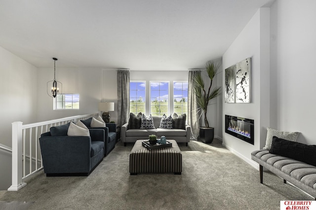 living room with carpet floors and a chandelier