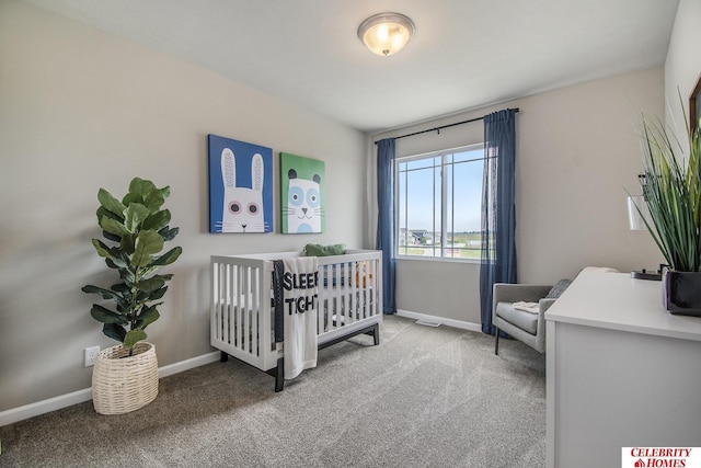 bedroom with carpet floors and a crib