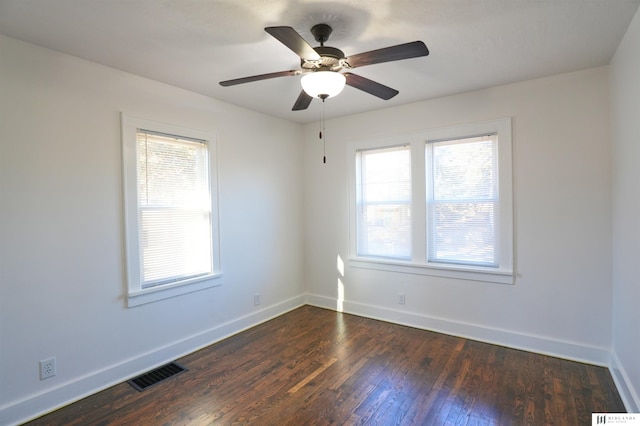 spare room featuring ceiling fan and dark hardwood / wood-style flooring