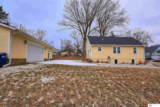 property exterior at dusk with a yard