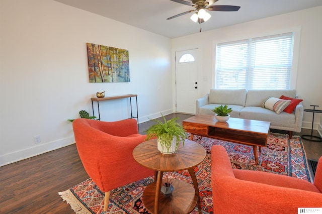 living room with ceiling fan and dark hardwood / wood-style floors