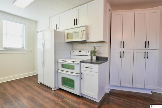 kitchen featuring dark hardwood / wood-style flooring, white appliances, tasteful backsplash, and white cabinets