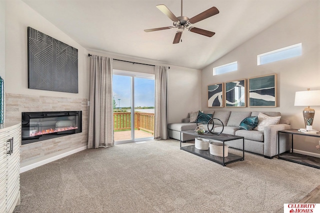 carpeted living room featuring ceiling fan and lofted ceiling