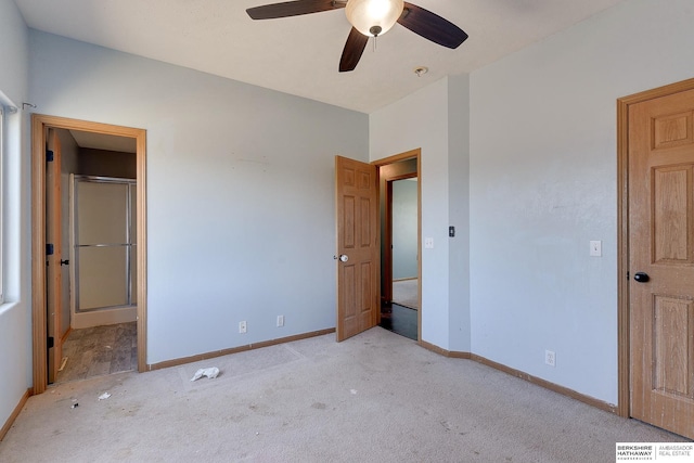 unfurnished bedroom with ceiling fan and light colored carpet