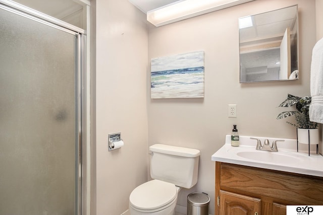 bathroom with walk in shower, vanity, and toilet