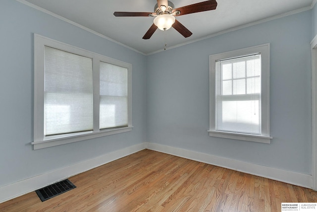 spare room featuring ceiling fan, light hardwood / wood-style floors, and crown molding