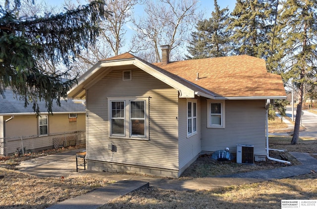 view of home's exterior featuring cooling unit and a patio area