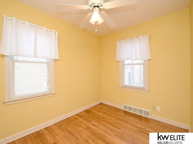 spare room featuring ceiling fan and light hardwood / wood-style floors