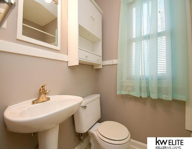 bathroom with sink and toilet