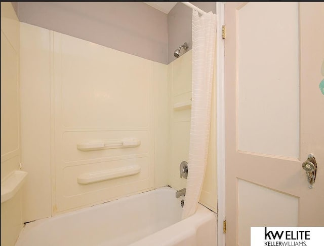 bathroom with shower / bathtub combination with curtain