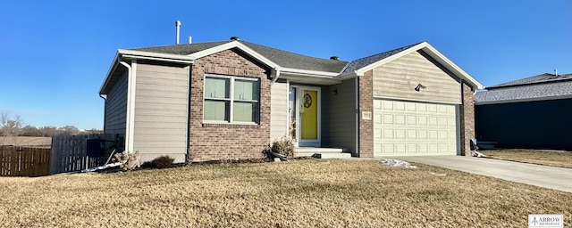 view of front of home with a front lawn and a garage