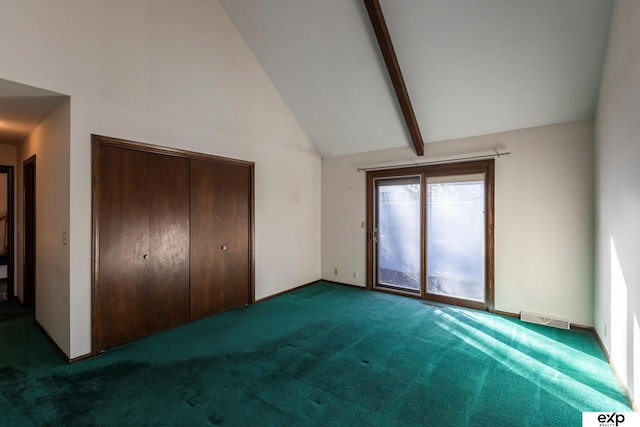 unfurnished bedroom featuring high vaulted ceiling, a closet, beamed ceiling, and carpet flooring