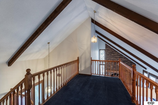 additional living space featuring vaulted ceiling, an inviting chandelier, and carpet flooring