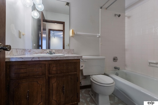 full bathroom with toilet, tiled shower / bath combo, and vanity