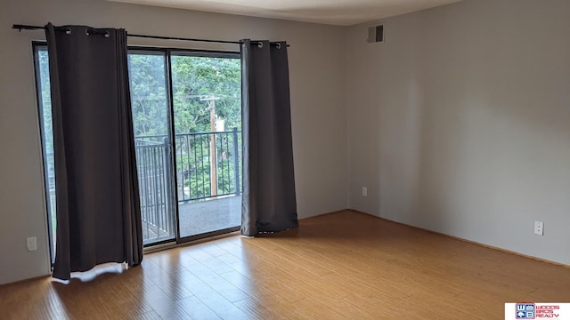 spare room with light hardwood / wood-style floors