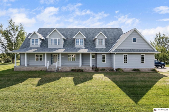 view of front facade with a front yard and a porch