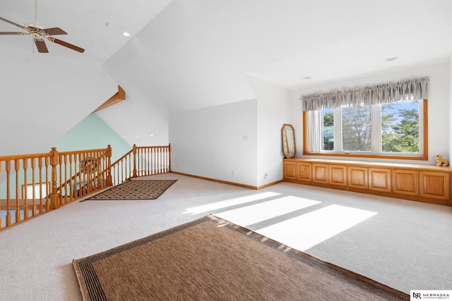 interior space featuring vaulted ceiling, ceiling fan, and light carpet