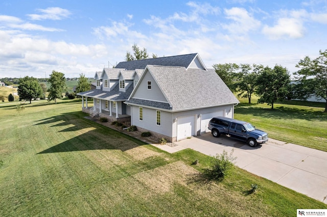 view of home's exterior featuring a garage, a porch, and a yard