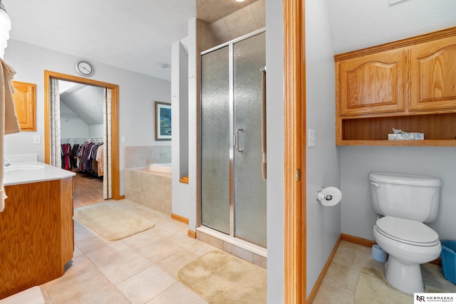 full bathroom with toilet, vanity, tile patterned floors, and plus walk in shower