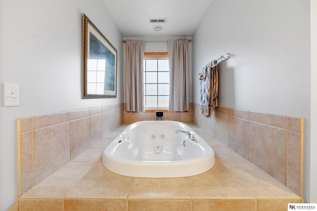 bathroom with tiled tub