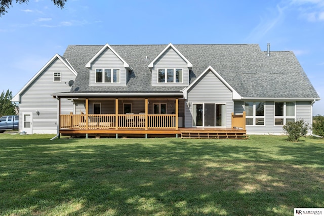 back of house with a wooden deck and a yard