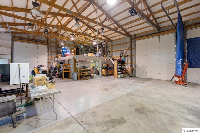 garage with a workshop area and a garage door opener