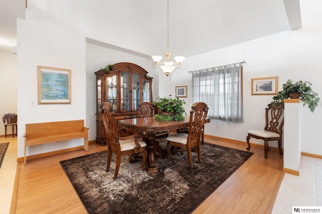 dining area featuring a notable chandelier and light hardwood / wood-style floors