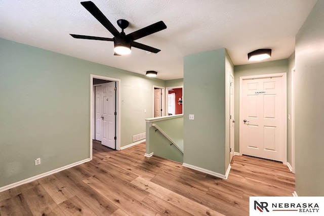 unfurnished room featuring ceiling fan and hardwood / wood-style floors