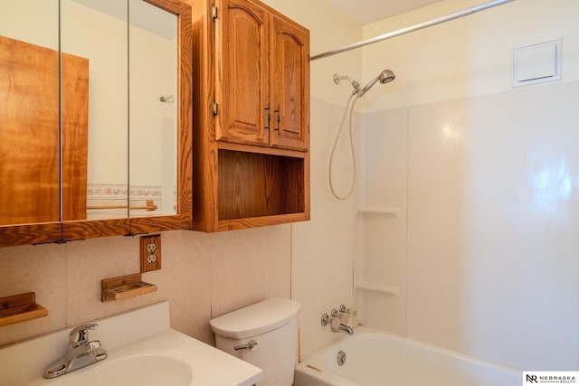 full bathroom featuring decorative backsplash, bathtub / shower combination, vanity, and toilet