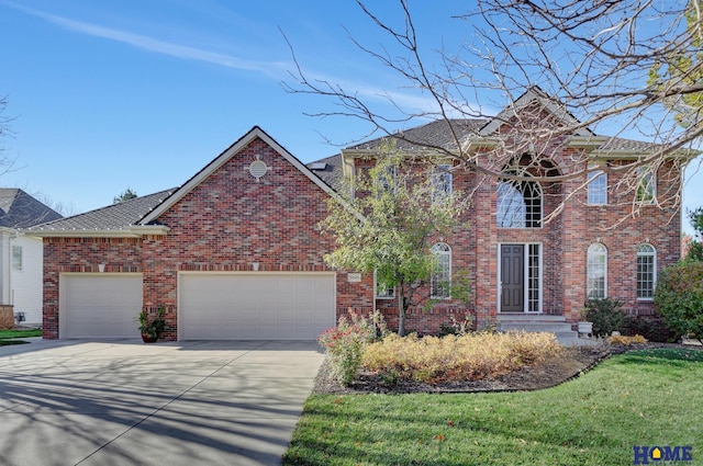 view of front facade featuring a front lawn and a garage