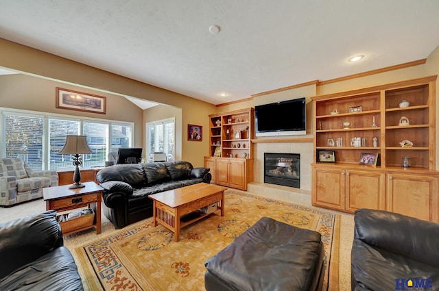 living room with a tile fireplace