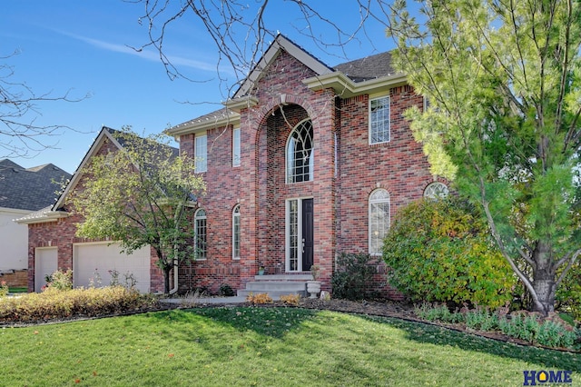 view of front of property with a garage and a front yard