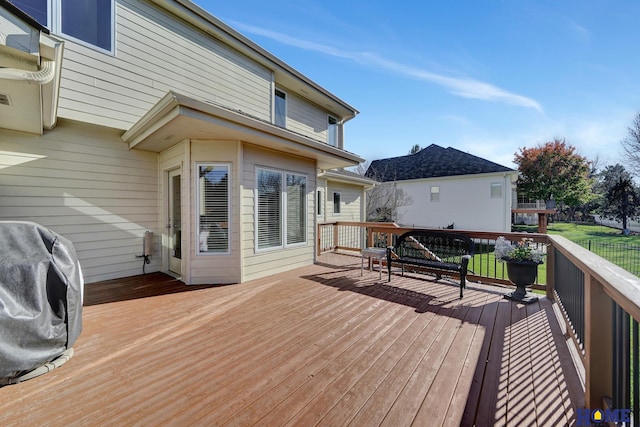 wooden deck with grilling area