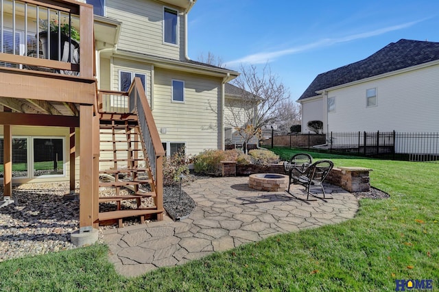 view of patio / terrace featuring a wooden deck and a fire pit