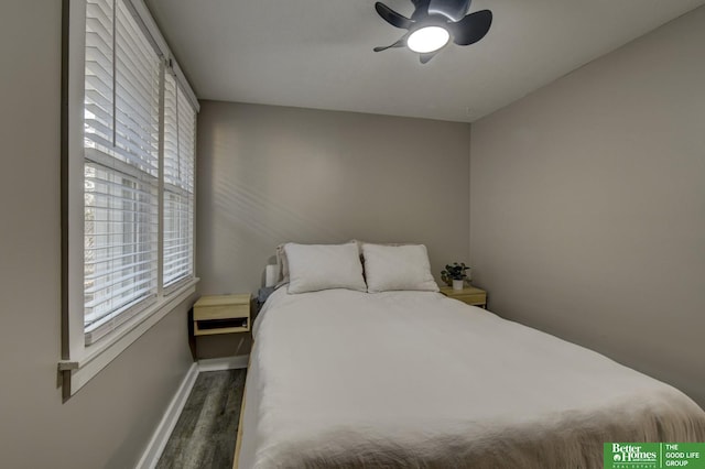 bedroom with ceiling fan and dark wood-type flooring