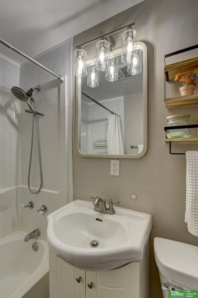 full bathroom featuring toilet, vanity, and shower / tub combo with curtain