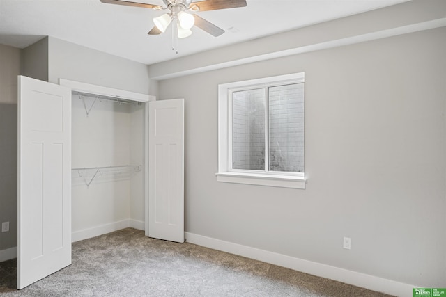 unfurnished bedroom with ceiling fan, a closet, and light carpet