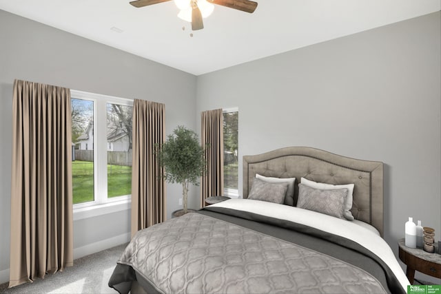 bedroom featuring ceiling fan and light colored carpet