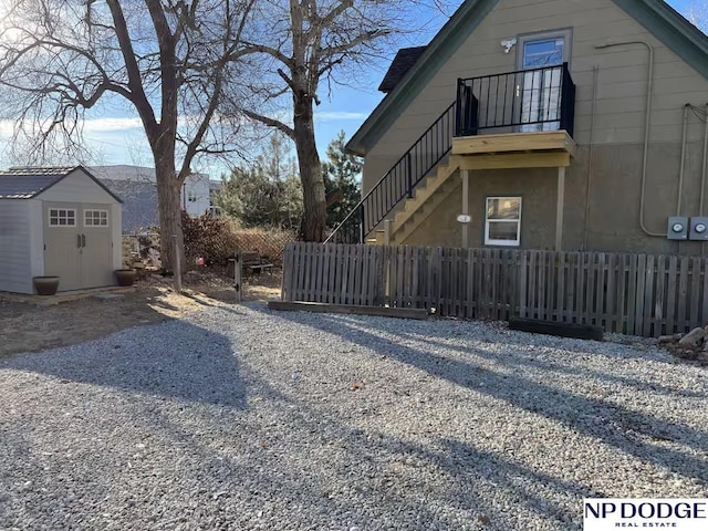 view of property exterior with a storage shed