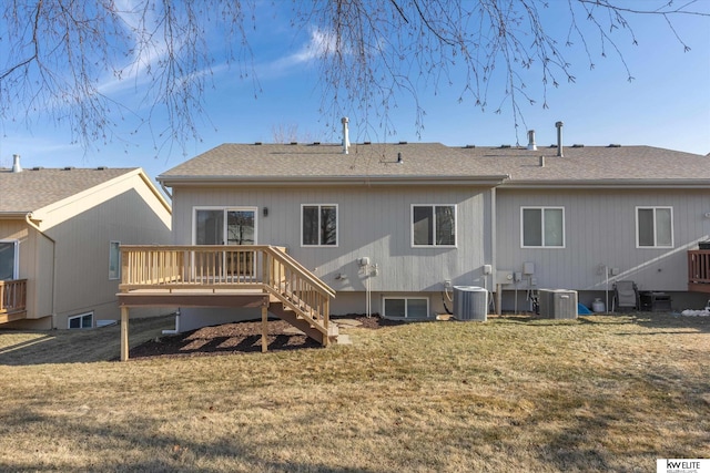 back of property with a wooden deck, a yard, and central air condition unit