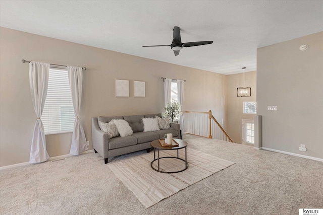 living room featuring ceiling fan and light carpet